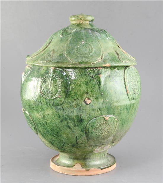 A Chinese green glazed pottery jar and cover, Yuan dynasty (1271-1368), height 34.5cm